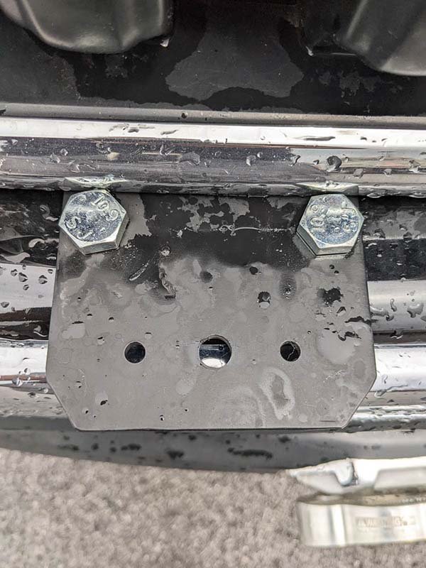 The finished custom light bracket bolted to the stock front bumper