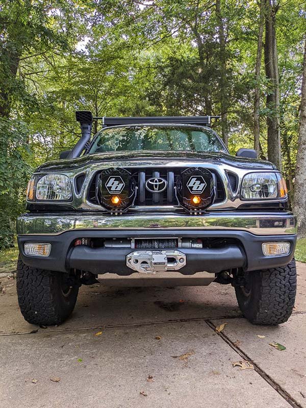 Both LP9 Pro lights mounted low on the front bumper of the Tacoma